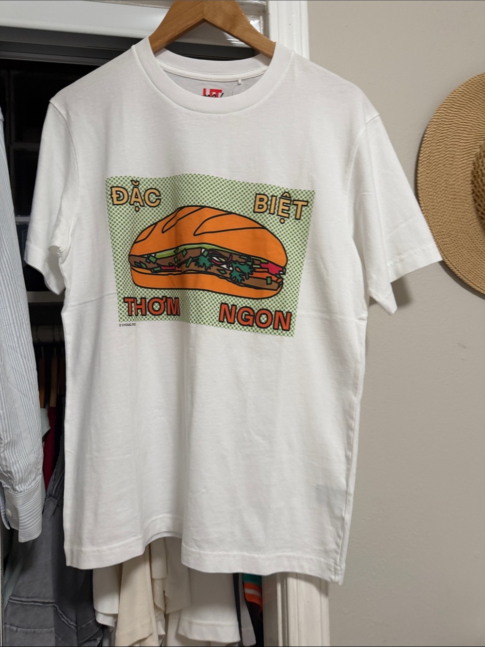 Uniqlo White Tee with Orange Bánh Mì Graphic